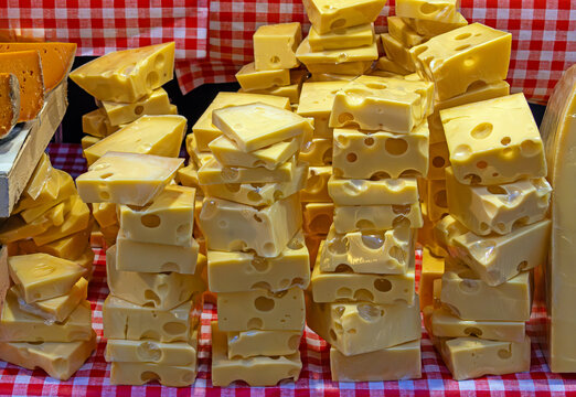 Emmental medium hard cow milk cheese originating from Switzerland sold on market stall