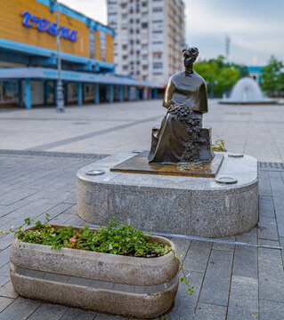 SLAVONSKI BROD, CROATIA  - JUNE 10, 2022: Monument to Ivane Brlić Mažuranić, a famous Croatian writer for children, located in central square of the city.