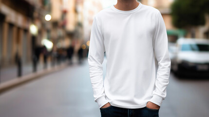 Fototapeta premium Man in blank white long sleeve shirt standing on city street, apparel mockup and lifestyle concept.