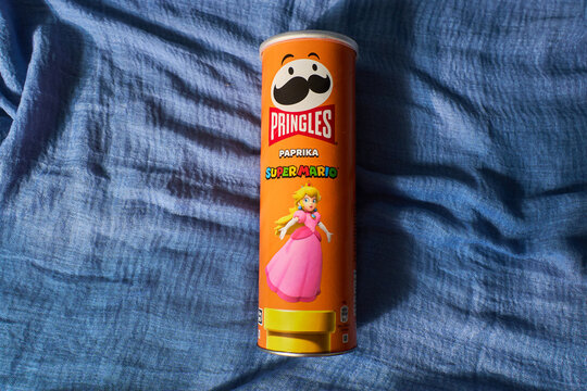 Tyumen, Russia-March 20, 2026: Nintendo Super Mario themed Pringles tube on a studio background with geometric shadows