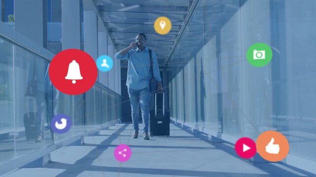 Man walking glass bridge talking on phone and pulling suitcase while call causing tech icons hiding