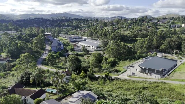 Drone flies north over New Checkers neighborhood and past Sozisa Road in the late afternoon in Mbabane, Eswatini