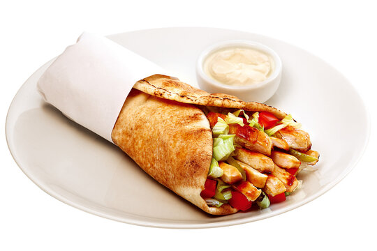 Shawarma sandwich with grilled chicken, vegetables, and garlic sauce, isolated on a plate against a transparent background.