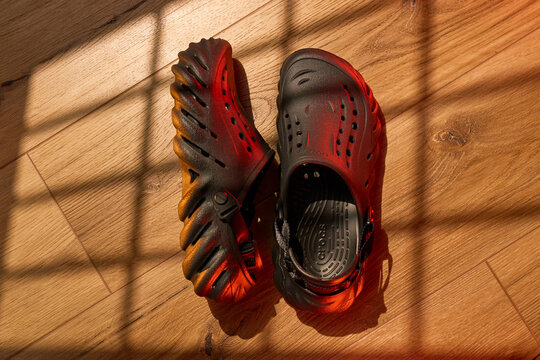 Tyumen, Russia-February 15, 2026: Different styles of crocs on display in a bright environment showing Echo Clog design and colors