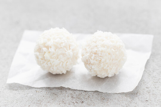 Vegan Coconut balls. Light background. Close up