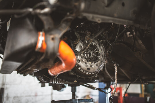 Close-up view of a car's transmission clutch assembly during repair or maintenance
