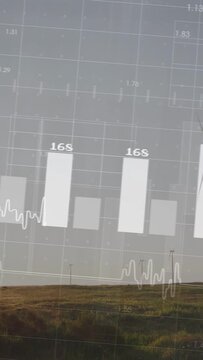 Vertical video: Turbine rotating while sensor driving overlay with power bars  and  wave tracking kW