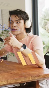 Vertical video: Podcast host bringing hand to mouth explaining showing watch overlays around host