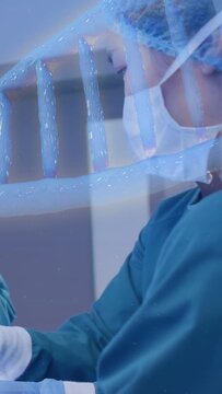 Vertical video: RN prepping tool for medical procedure gloved hands entering blue wave appearing