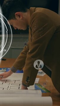 Vertical video: Architect unfolding blueprints, marking plan for review while HUD avatars rotating