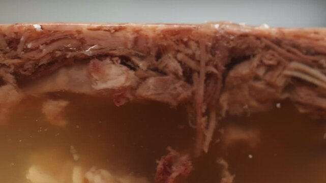 Meat aspic, slavic food, Traditional Russian pork meat aspic Kholodets with horseradish, mustard, jellied jelly beef, eating in restaurant chicken tasty dish. Close up on kitchen. 