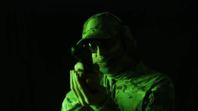 Portrait of modern soldier in military uniform and a helmet with headphones rifle, army warrior Warrior Military Gear Ready for Battle, airsoft Players in Tactical Gear and Riot Police Training