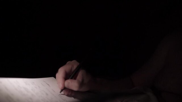 Man Journaling at Night for Self Help and Depression