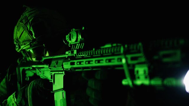 Portrait of modern soldier in military uniform and a helmet with headphones rifle, army warrior Warrior Military Gear Ready for Battle, airsoft Players in Tactical Gear and Riot Police Training