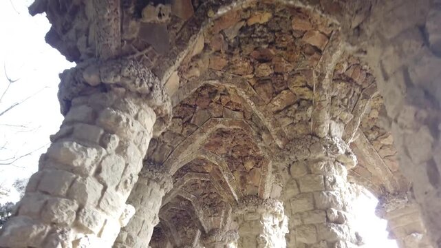 Walking Through Park Guell Barcelona POV. Walking through Park Guell in Barcelona. Iconic Gaudi park and major tourist attraction in Spain.