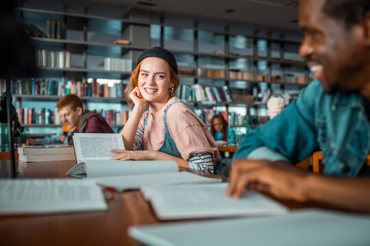 College students studying together in library