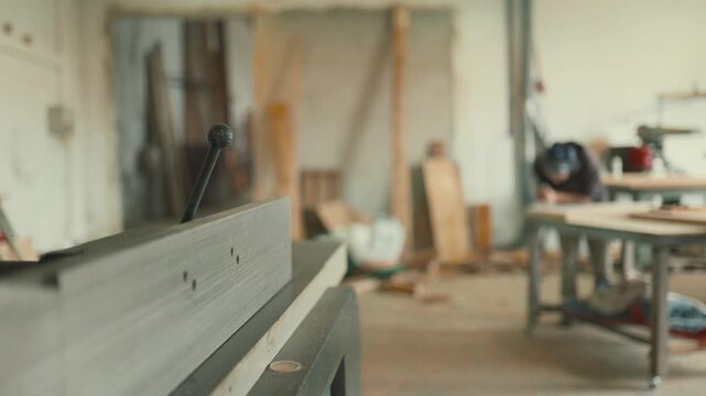 Woodworking jointer planer machine in a carpentry workshop