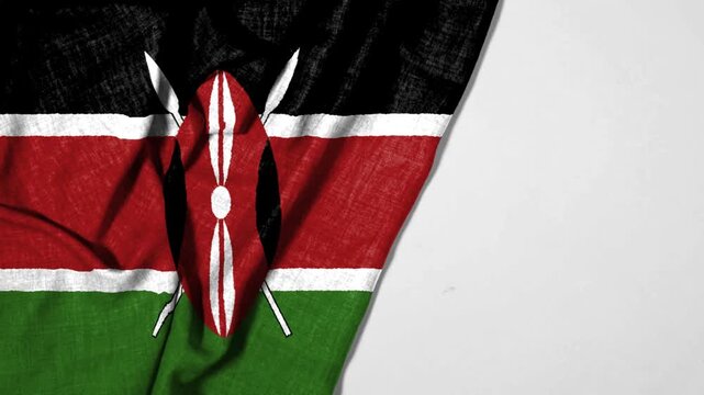 Kenya&rsquo;s flag with black, red, and green stripes, white borders, and a central Maasai shield&mdash;symbolizing unity, freedom, and cultural strength