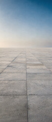 Fototapeta premium An abandoned runway in a desert landscape with a clear blue sky above.