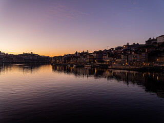 Porto ribeira cityscape reflecting in douro river © Paul