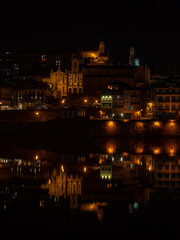 Porto city night view reflecting on douro river © Paul
