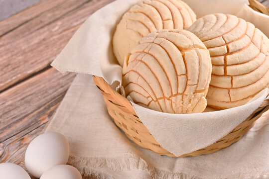 Traditional Mexican sweet bread concha in a wicker basket