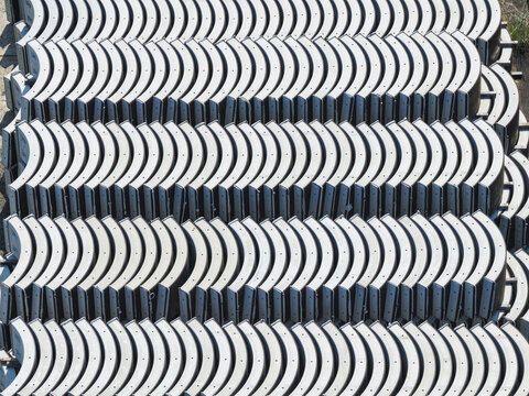 Aerial view of rows of stacked curved concrete segments and precast tunnel lining components in Taiwan.