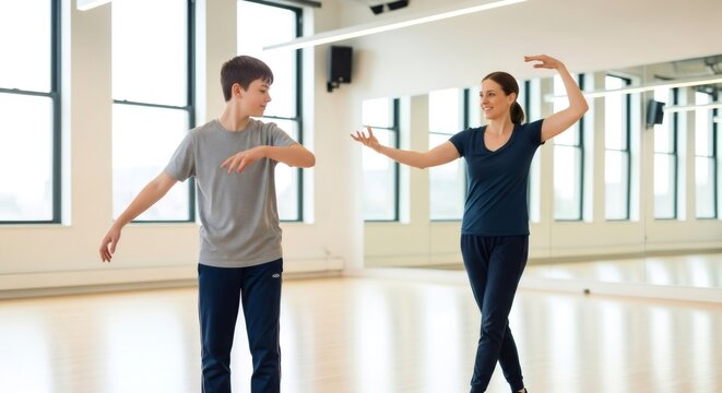 Woman leading movement class for boy with autism spectrum disorder. Supportive dance therapy for special needs child. World Autism Awareness Day concept.