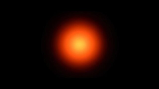 Radiant Glow: A mesmerizing display of a vibrant, soft orange light against a deep, enveloping darkness, creating a sense of warmth and energy. 