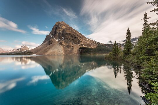 Rocky mountain and forest reflections in Bow Lake, Banff National Park, Alberta, Canada