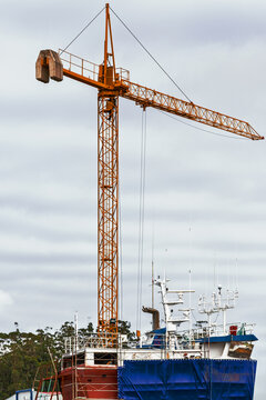 Naval infrastructure with a construction crane and vessel