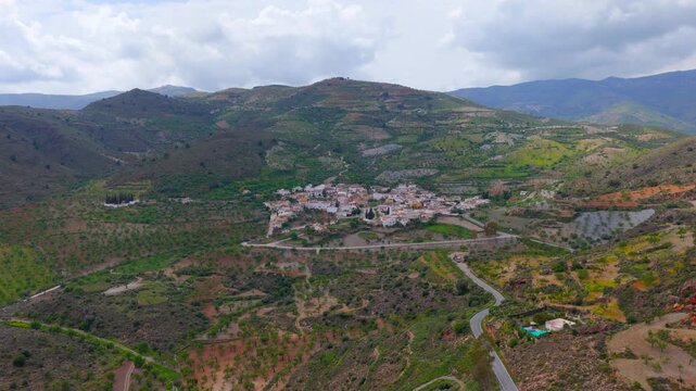 Turon village in mountains, Andalusia, Spain. Aerial view by drone