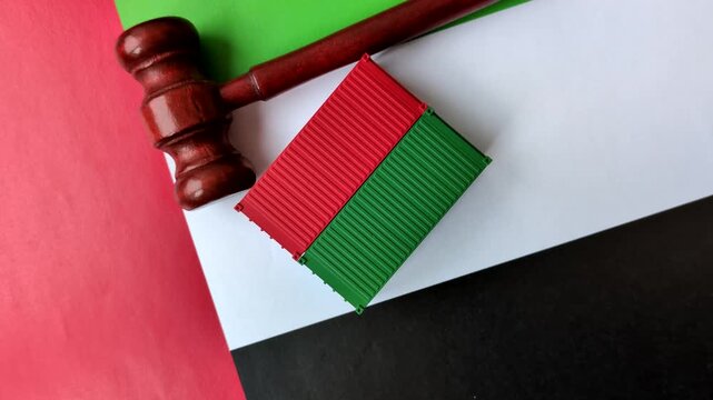 The cargo container ban on the united emirates flag as a conceptual backdrop for the export and logistics of goods. The cargo container embargo on the uae flag as a backdrop for your design