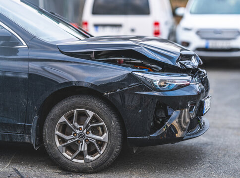 Gothenburg, Sweden - March 15 2026: Classic red Mercury Cougar convertible parked beside urban street.