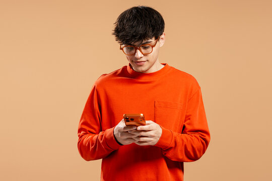 Young man using smartphone for digital communication