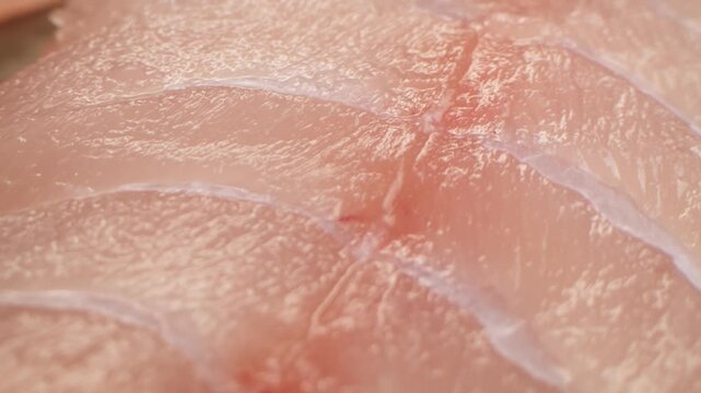 Cooking fish Peruvian ceviche close-up. Fresh cooked ceviche made of raw white fish. Traditional Peruvian cuisine. Cooking seafood dish.