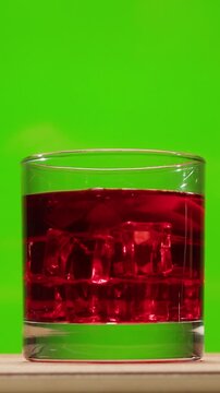 Vermouth Negroni, spanish wine drink, Alcoholic Americano Cocktail bitter, sweet vermouth and soda water, close up of making drink, summer spanish vacations. 