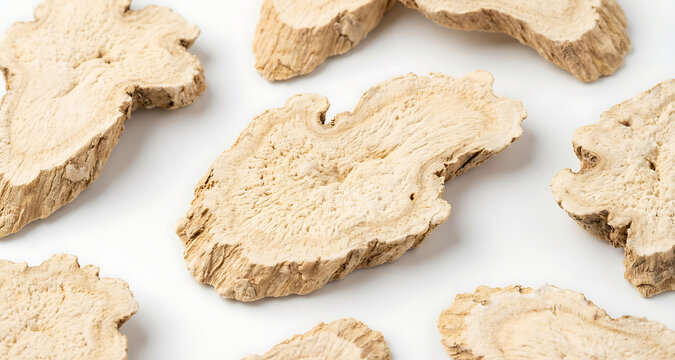 Sliced Dried Astragalus Root on White Background