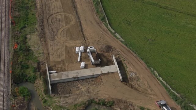 Road Construction Site from Above: A bird's-eye perspective reveals an active road construction site, showcasing the intricate process of infrastructure development amid natural landscapes.
