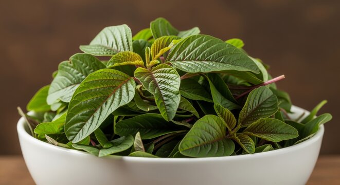 Fresh Amaranth Greens Piled in a White Bowl