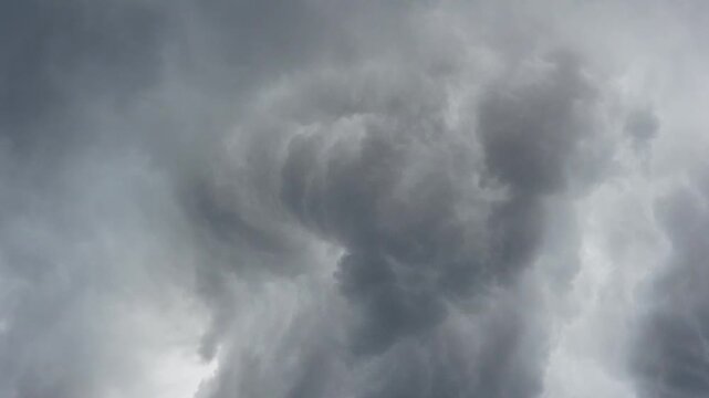 Dark dense storm clouds, dramatic threatening sky close-up