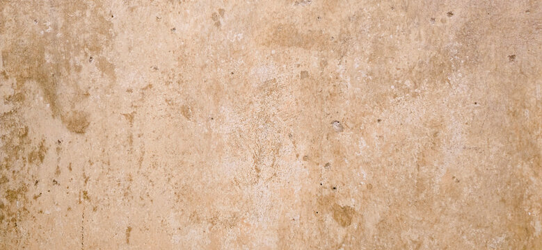 Textured Beige Plaster Wall With Weathered Stains And Rustic Aged Surface Background