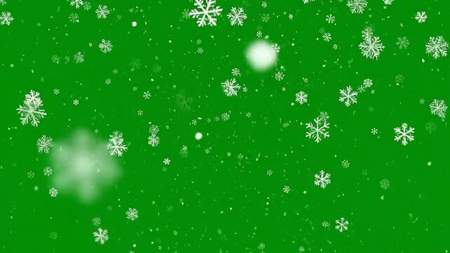 Falling snowflakes on a vibrant green background, perfect for winter holiday themes and designs