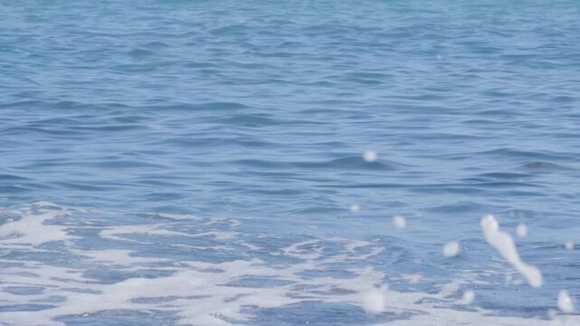 Atlantic Ocean waves crash gently on shore, warm Gulf Stream current, relaxing coastal scene, natural power, sea breeze, aquatic travel