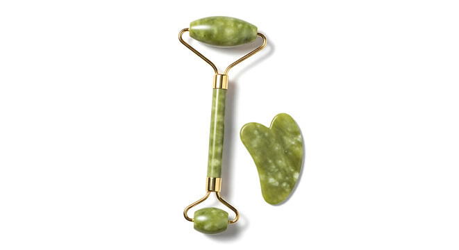 Green jade facial roller and gua sha stone, tools for skincare and beauty, self-care massage, anti-aging and lymphatic drainage, isolated on white