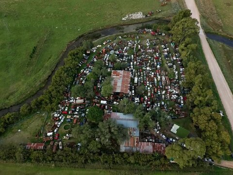 Aerial Top-Down View of a Large Automotive Scrapyard and Recycling Center