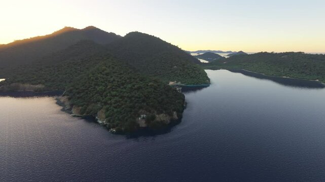Circular aerial drone shot at sunset of Anse Du Riz in Mahe island. Seychelles
