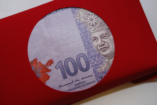 One Hundred of Malaysia Ringgit in red envelope