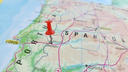 Obraz premium View of Badajoz, is the capital of the province of Badajoz in the autonomous community of Extremadura, Spain, on a geographical map of Europa, marked with red push pin