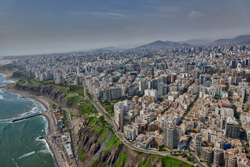 Fototapeta premium Aerial view of Miraflores and Costa Verde coastline in Lima, Peru, showcasing modern urban living along the Pacific Ocean with scenic cliffs, vibrant cityscape, and coastal landscapes. 